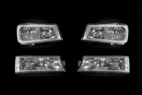 Four headlight assemblies on black background